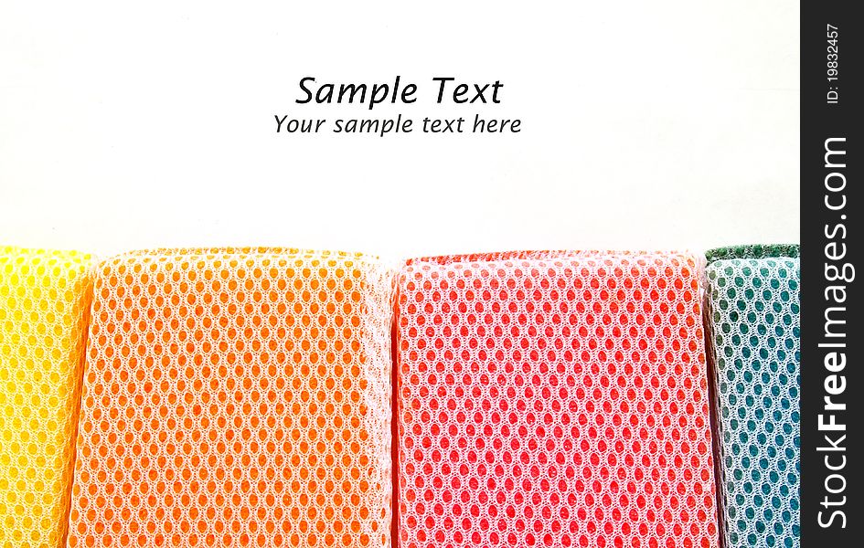 Colorful sponges isolated with copy space