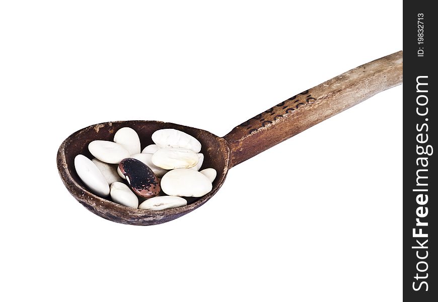 Wood spoon with beans isolated