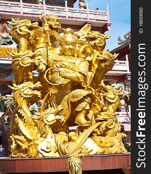 Goddess NaZha beating the dragon and china temple Chonburi Thailand