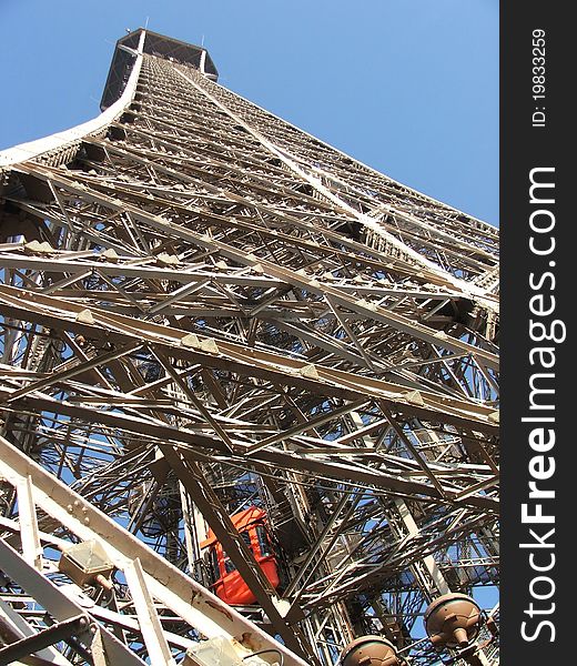 Looking up at the framework of the Eiffel tower