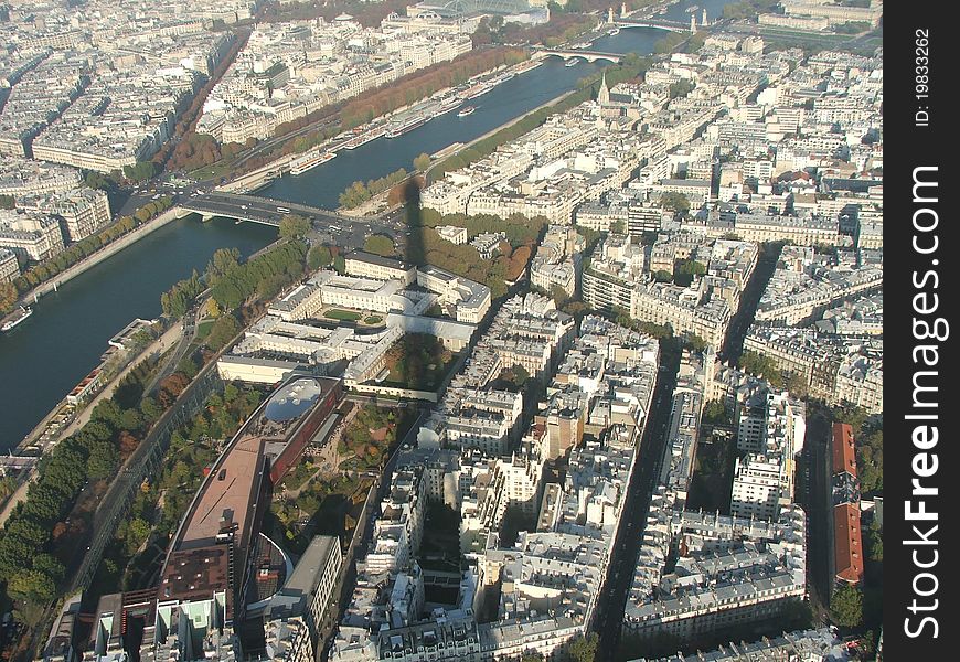 Shadow of eiffel tower overlooking the river seine and paris. Shadow of eiffel tower overlooking the river seine and paris