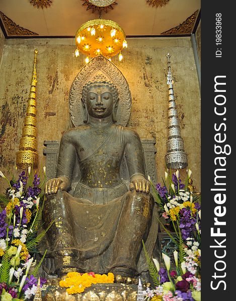 Statue of old buddha at thailand temple