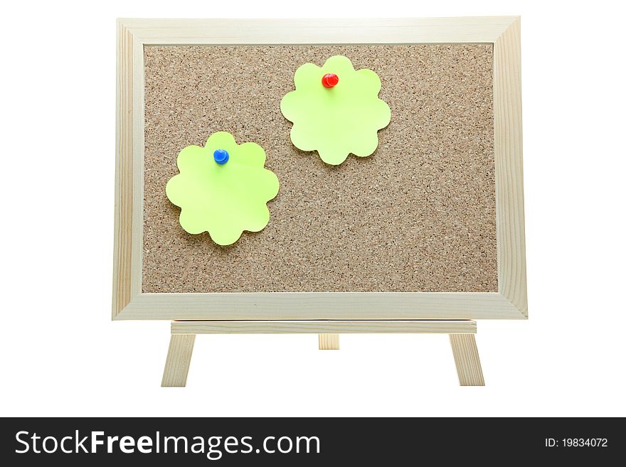 Two flower shape memo paper on cork board on white background. Two flower shape memo paper on cork board on white background