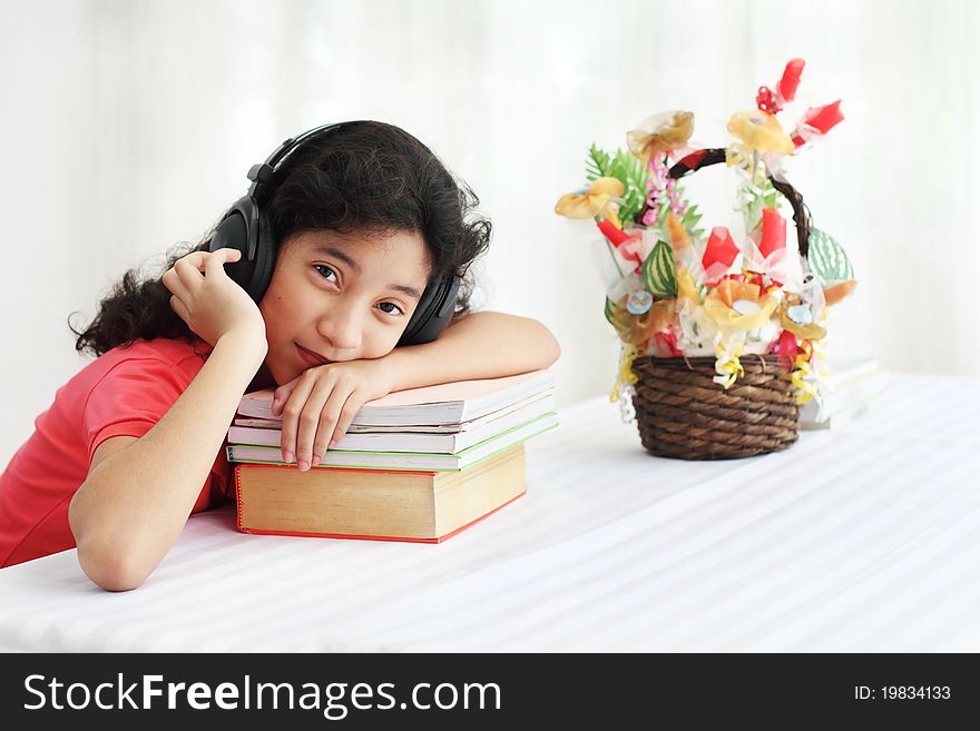 Young asian student listening to music. Young asian student listening to music