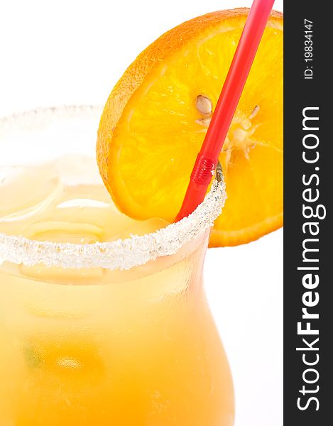 Orange cocktail with a tubule in a glass glass close up. Orange cocktail with a tubule in a glass glass close up