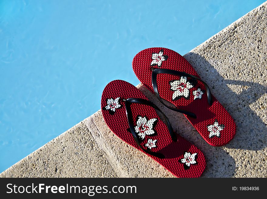 Flip-flops by the pool with great light and amazing colors