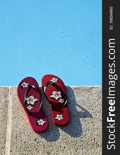 Flip-flops by the pool with great light and amazing colors