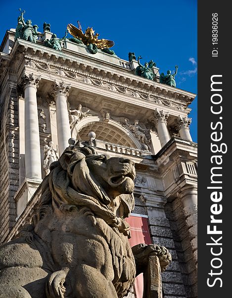 Stone lion sculpture guarding vienna's national library. Stone lion sculpture guarding vienna's national library