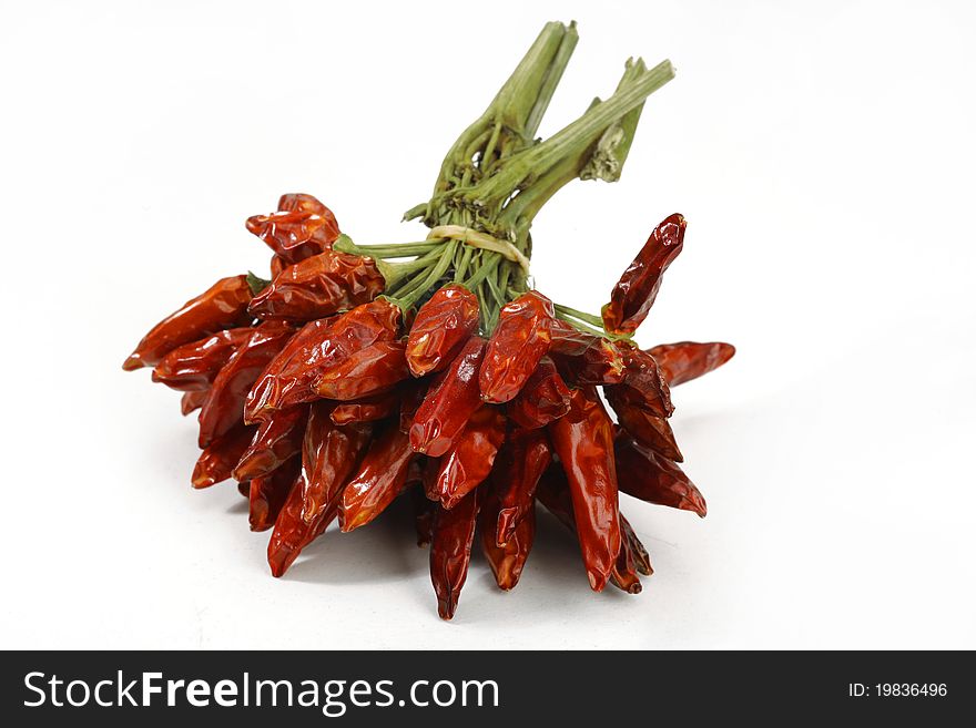 Bunch of Dried chili peppers isolated on white background