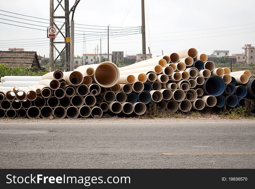 The pvc pipe beside the road.