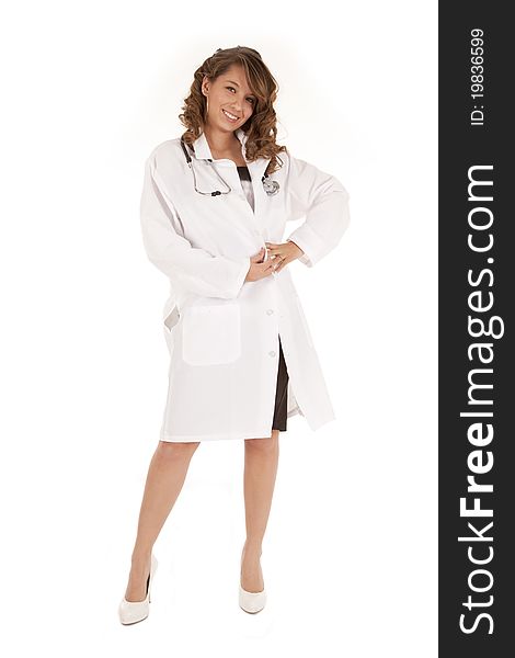 A woman doctor standing and posing in her lab coat. A woman doctor standing and posing in her lab coat.