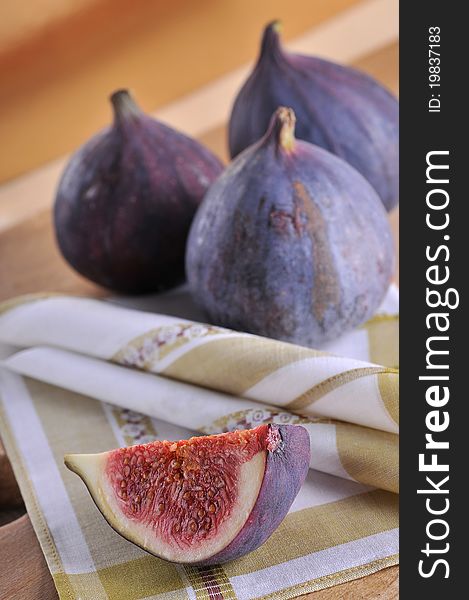 Slice fig on wood background. Slice fig on wood background