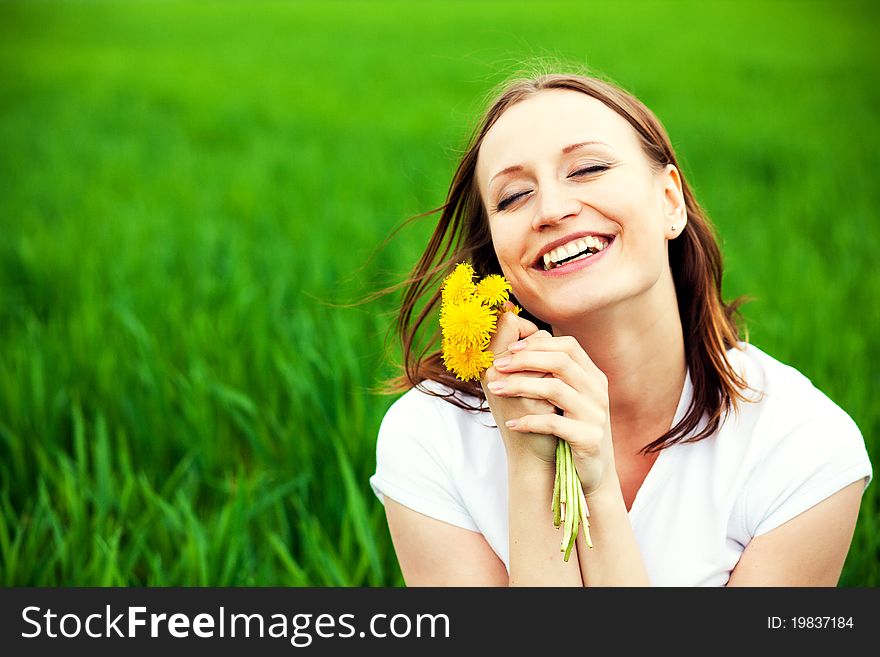 Woman with bouquet dandelions outdoors. Woman with bouquet dandelions outdoors