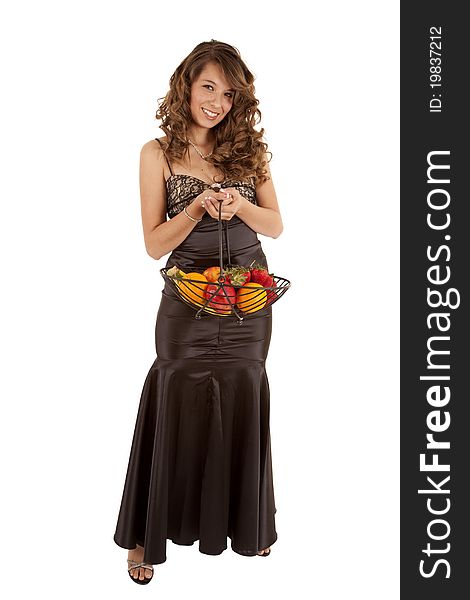 A beautiful woman in her black formal dress, with a smile on her face, holding a bowl of fruit. A beautiful woman in her black formal dress, with a smile on her face, holding a bowl of fruit.