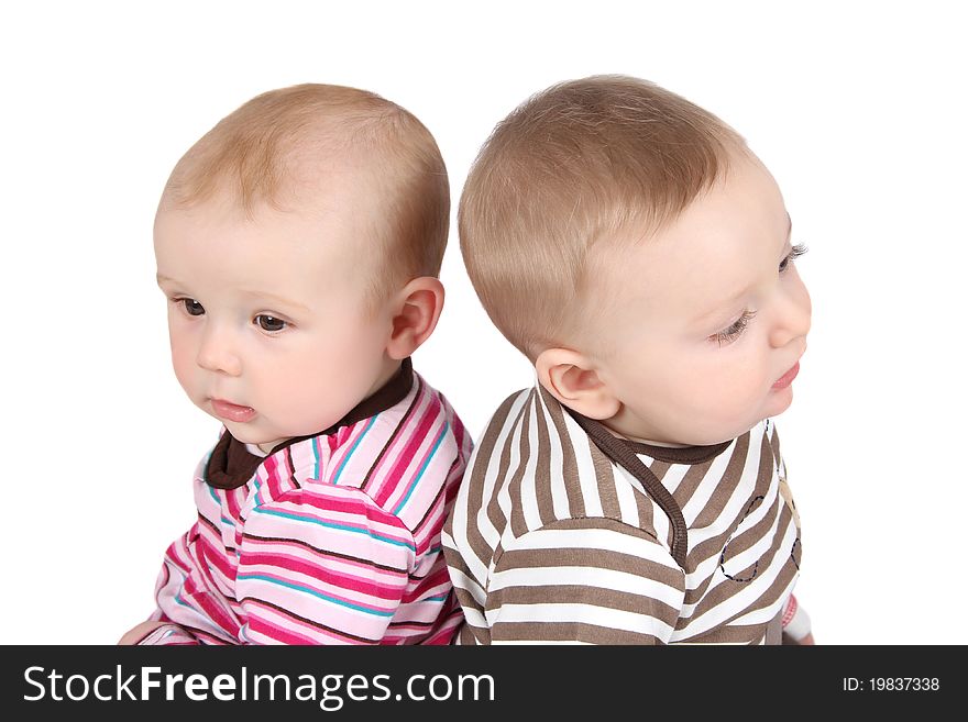 Baby boy and girl wearing striped clothing. Baby boy and girl wearing striped clothing