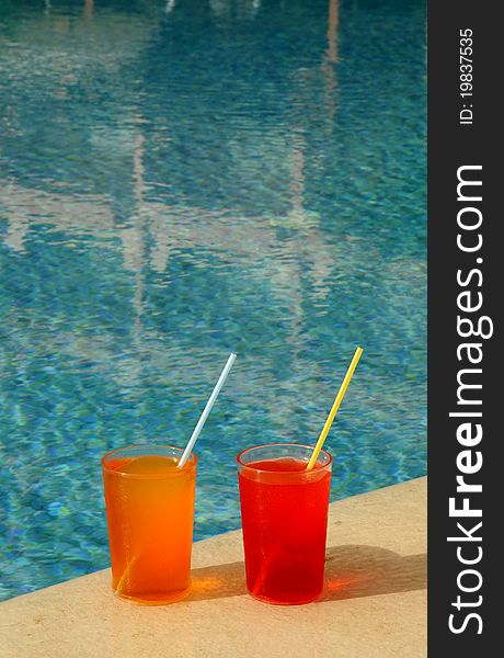 Drinking Glasses by a Swimming Pool. Drinking Glasses by a Swimming Pool