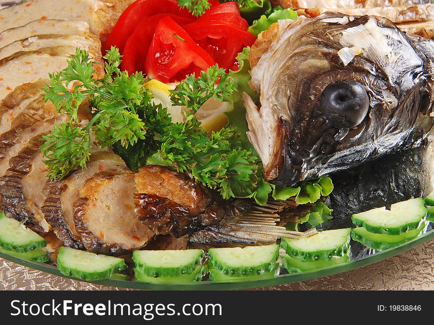Stuffed fish with head on the plate