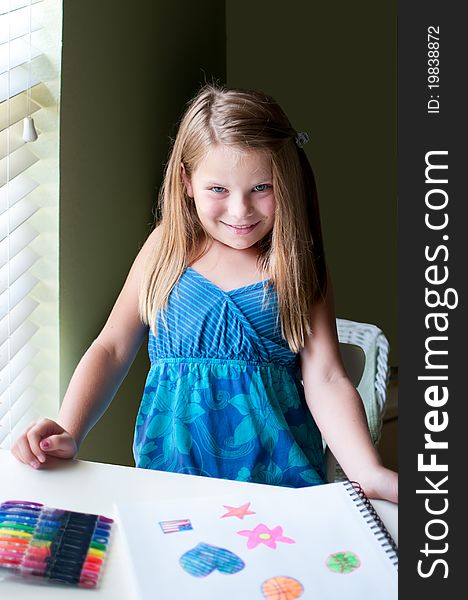 Young Girl Drawing By Window