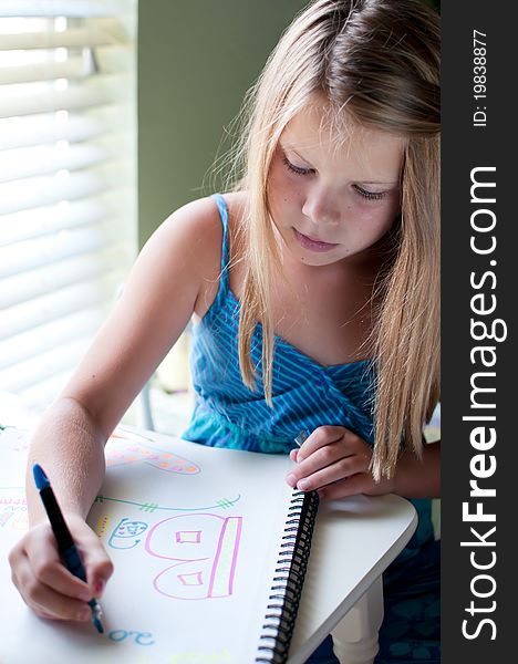 Young Girl Drawing By Window