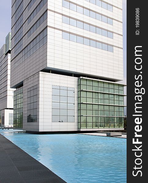 View by the swimming pool of a modern building. View by the swimming pool of a modern building