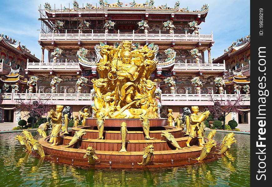 Goddess Naja beating the dragon at china temple in Chonburi Thailand