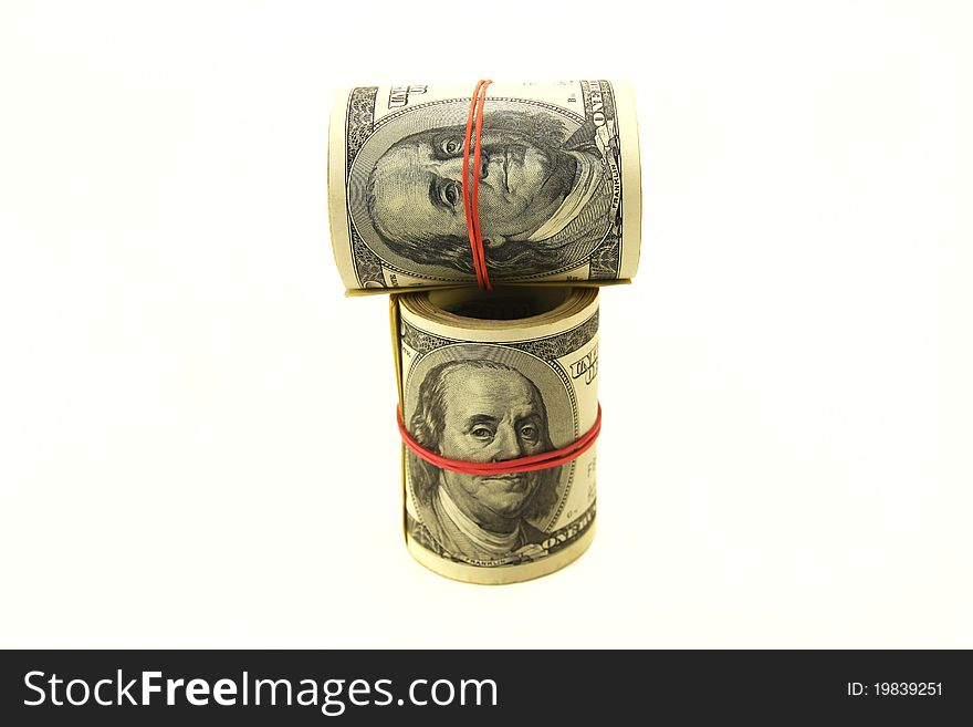 Rolls of money on a white background