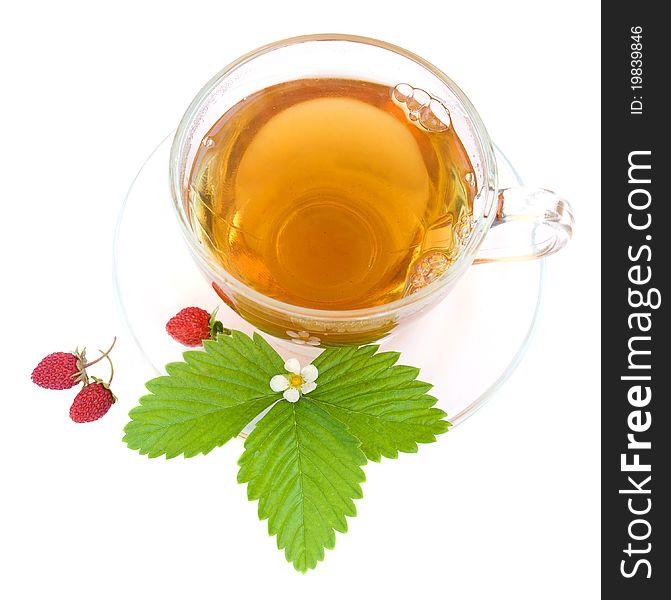 Cup of tea and wild strawberries on a white background