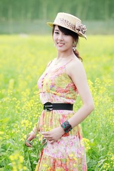 Asian Beauty In Rape Field Royalty Free Stock Photo