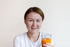 Woman Holding A Glass Of Orange Juice Royalty Free Stock Photography