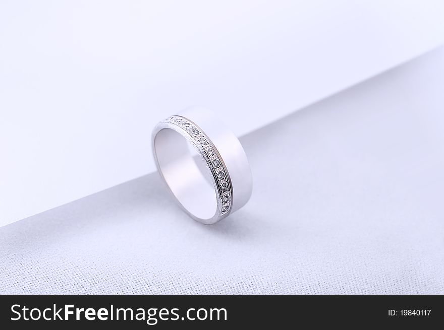 Diamond wedding rings on white background