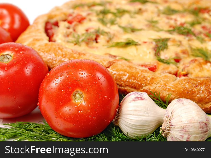 Pizza, tomatoes and garlic close up