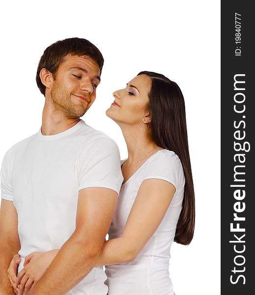 Portrait of a young beautiful smiling couple in studio