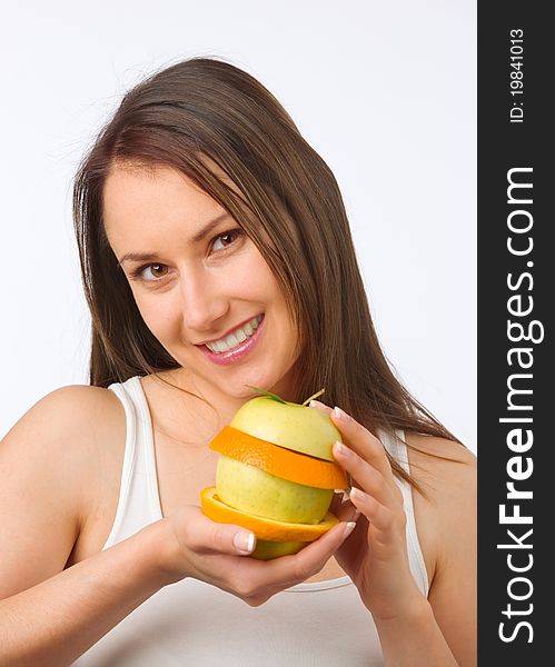 Young woman with fresh fruit in her hands