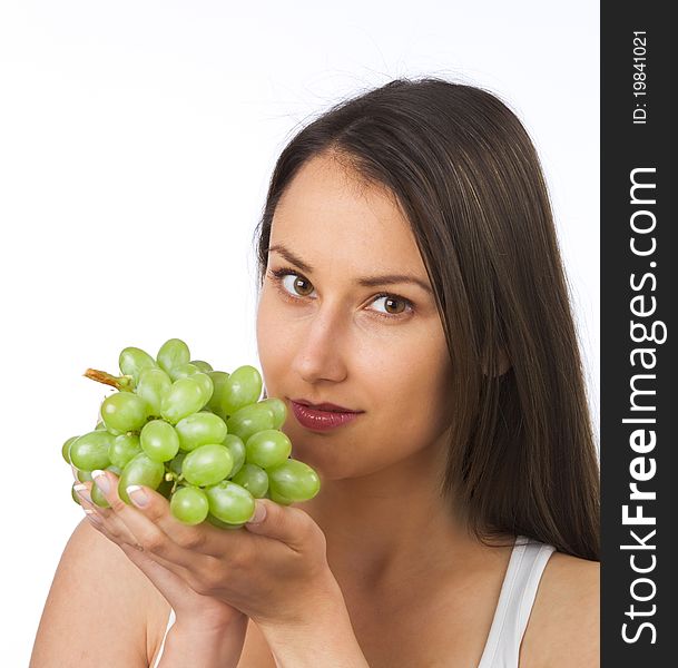 Young woman holding fresh grapes in her hands. Young woman holding fresh grapes in her hands