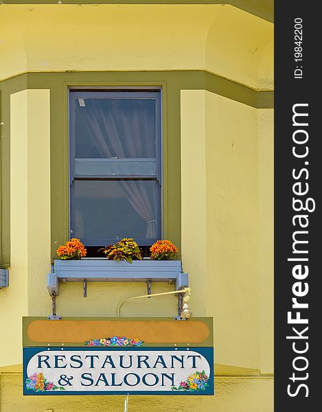 Rustic restaurant& saloon sign in small California town