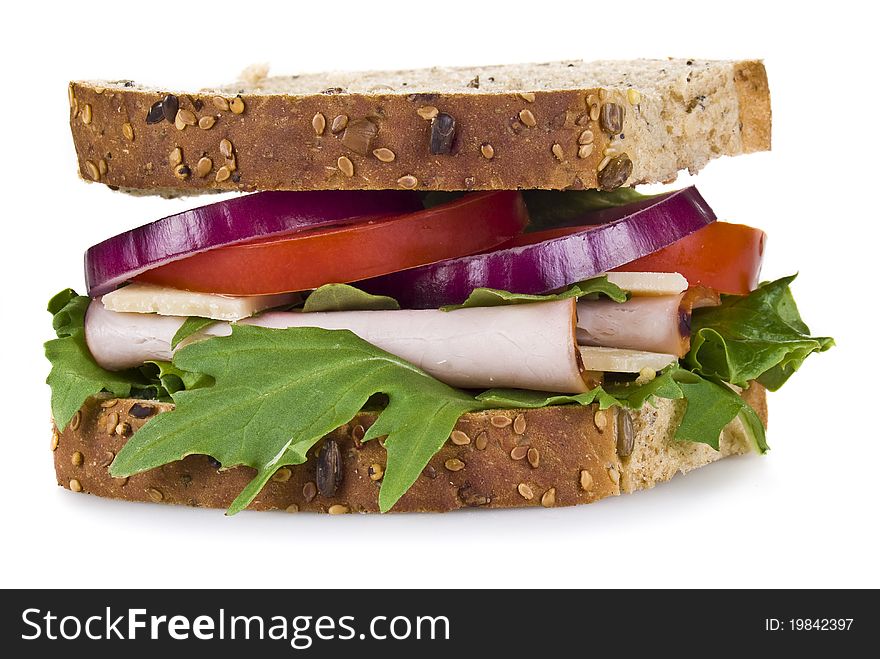 Freshly made ham and vegetable sandwich - isolated. Freshly made ham and vegetable sandwich - isolated