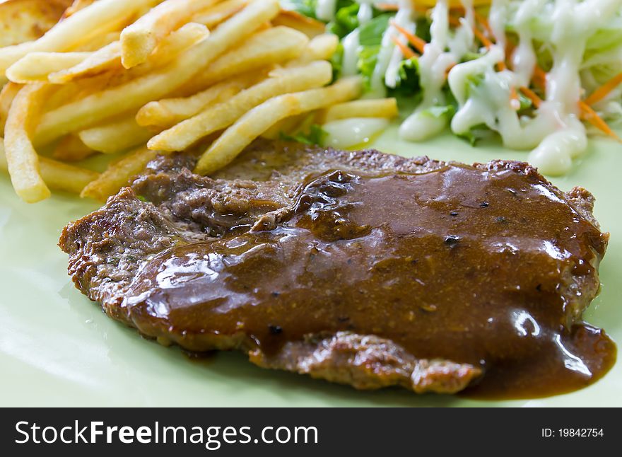 Steak with fresh vegetables salad