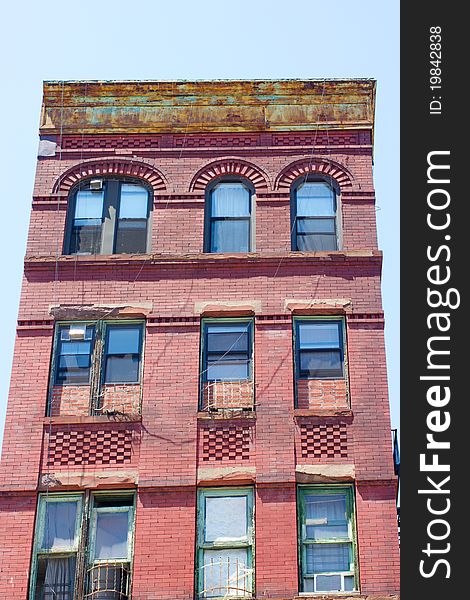 A typical tenement style apartment building in New York City. A typical tenement style apartment building in New York City