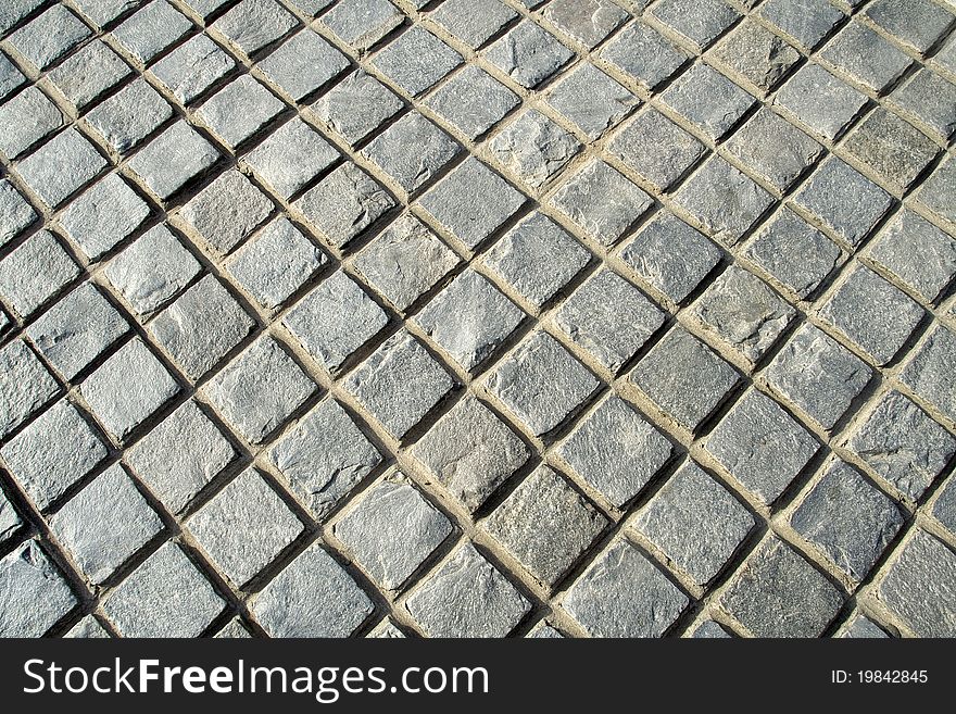 Diagonal view of pattern of checked stone pavement. Diagonal view of pattern of checked stone pavement