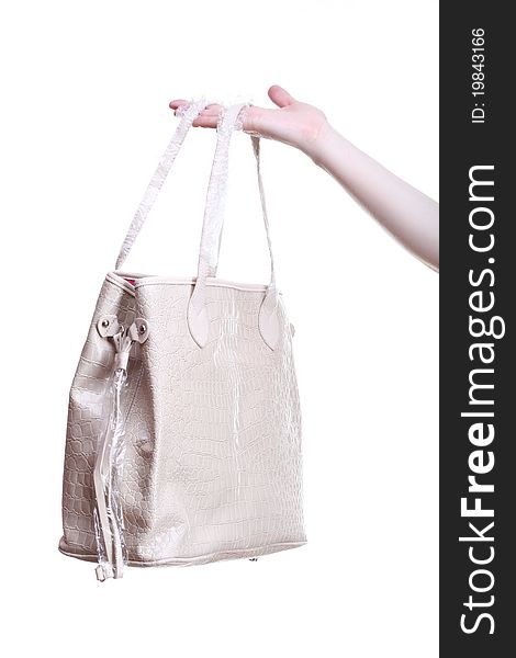 New Handbag in woman hand isolated