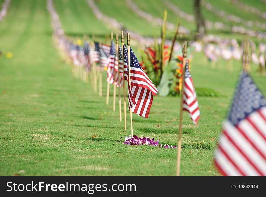 A row of flags at the grave sites on Memorial Day (2011) at the Punch Bowl National Cemetery on the Island of Oahu in Hawaii.