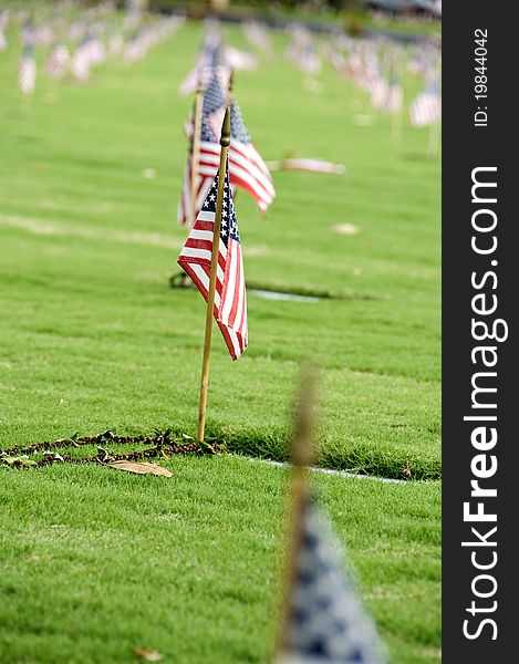 A row of flags at the grave sites on Memorial Day (2011) at the Punch Bowl National Cemetery on the Island of Oahu in Hawaii.