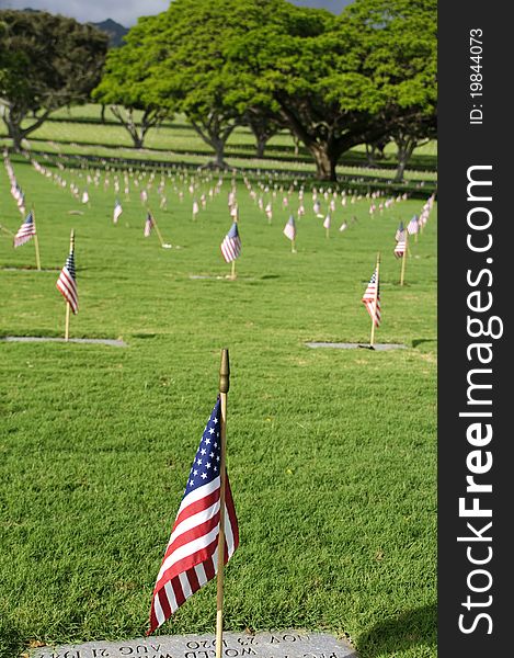 A row of flags at the grave sites on Memorial Day (2011) at the Punch Bowl National Cemetery on the Island of Oahu in Hawaii.