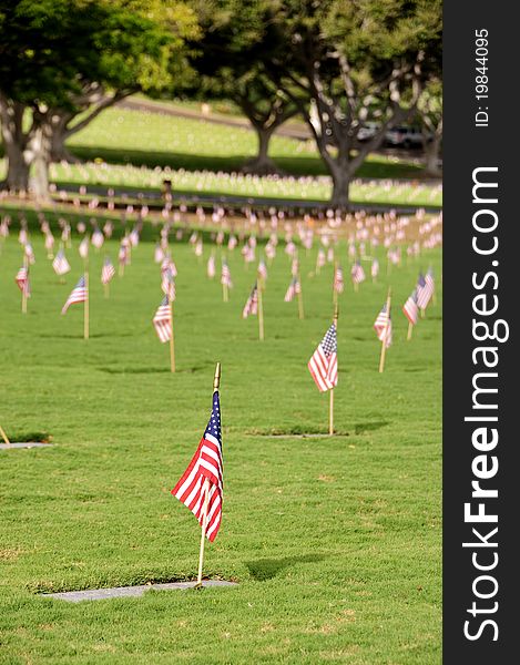 A row of flags at the grave sites on Memorial Day (2011) at the Punch Bowl National Cemetery on the Island of Oahu in Hawaii.