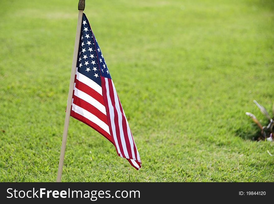 A USA flag at the grave site on Memorial Day (2011) at the Punch Bowl National Cemetery on the Island of Oahu in Hawaii.