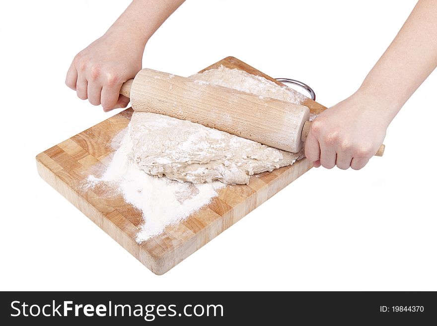 Studio-shot of hands roll out dough for bread, isloated on white. Studio-shot of hands roll out dough for bread, isloated on white.