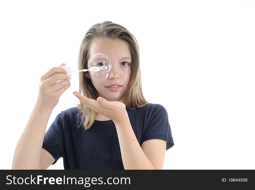 Adolescent playing with soap bubbles