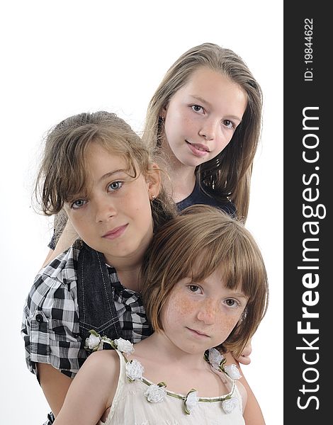 Pretty blonde children posing together in studio. Pretty blonde children posing together in studio