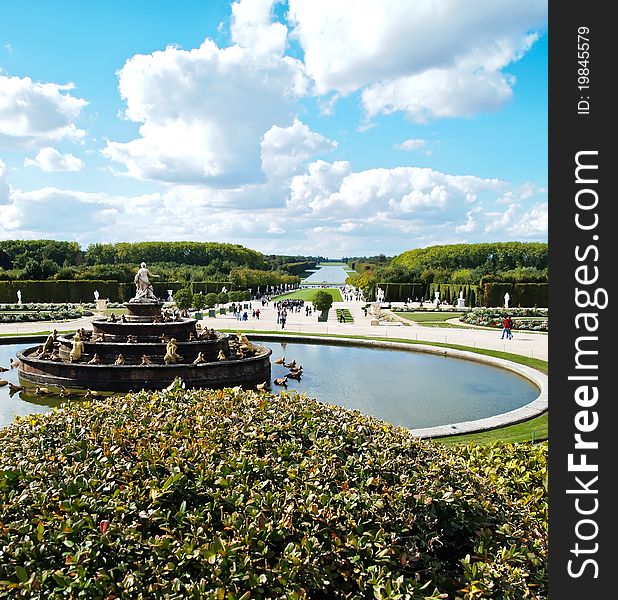 Decorative gardens & fountain with bright blue sky