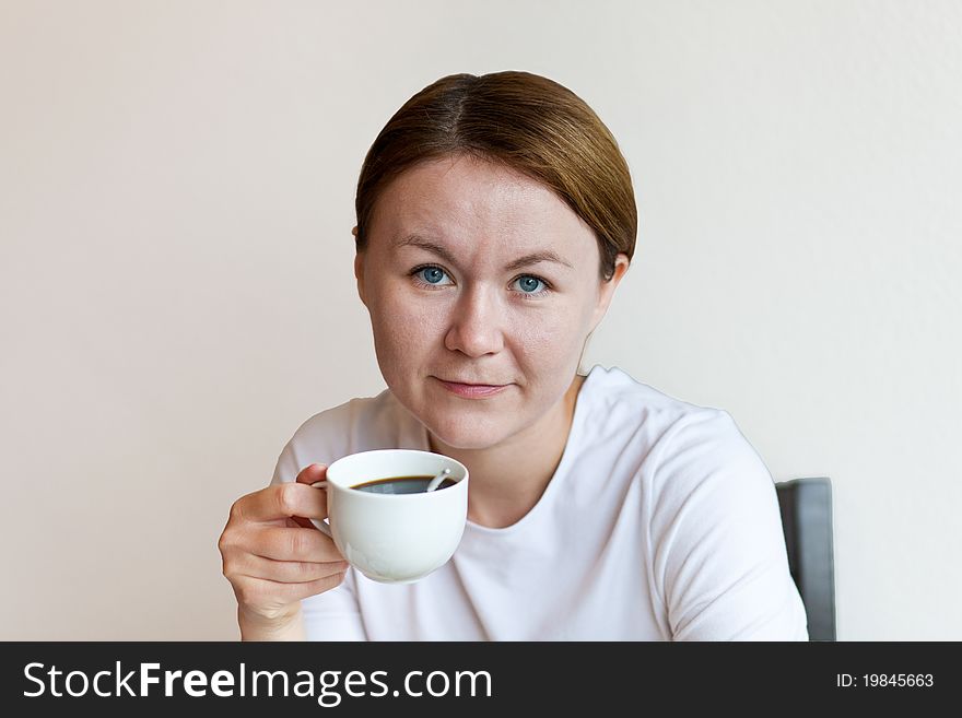 Woman holding a cup of coffee. Woman holding a cup of coffee